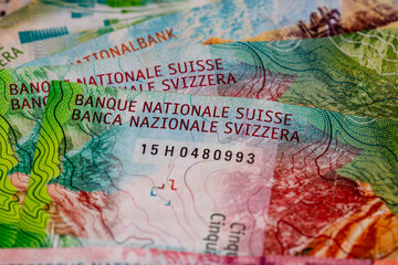 Naklejka premium Detail of Swiss Franc banknotes representing economy and inflation in Switzerland