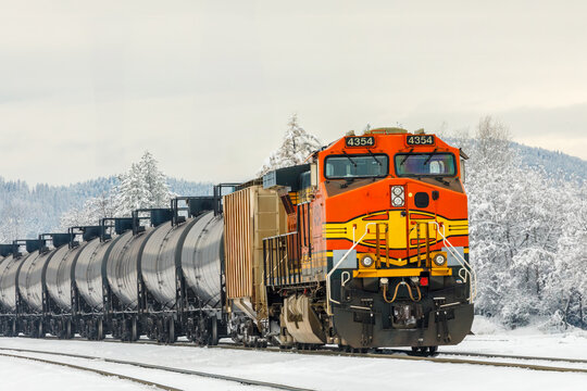 closeup of a freight train hauling tanker cars in winter in Montana