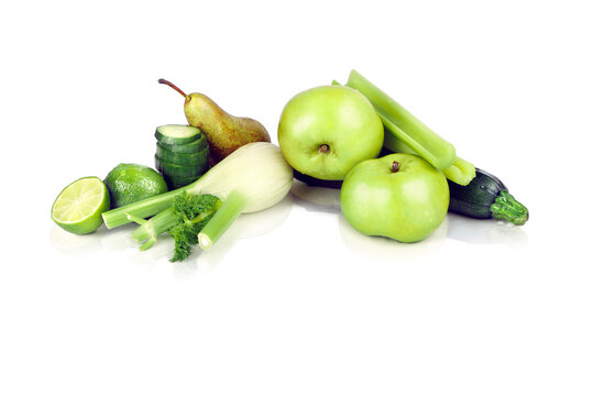 Assortment of Green Fruits and Vegetables Including Apples, Pears, Cucumber and Courgette on White Background