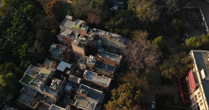 Aerial 4K view of houses in West Delhi, showing residential colony, rooftops, narrow streets, and dense urban neighborhood layout.