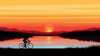Obraz premium Cyclist in silhouette with vibrant sunset over serene lake and mountains