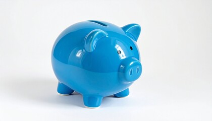 Blue ceramic piggy bank with glossy finish, coin slot on top, rounded snout with nostrils, black circular eyes, plain white background emphasizing savings, budgeting, and financial planning.