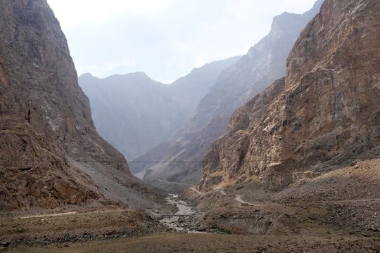 Panorama with Panj River and Pamir Mountains in Afghanistan, seen from Pamir Highway along  Panj River on Tajik-Afghan border.
