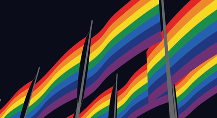 Fototapeta premium Rainbow flags waving against a dark sky, symbolizing LGBTQ+ pride and diversity.