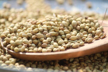 Fototapeta premium Coriander seeds close up texture background