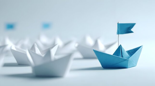 The concept of leadership is depicted by an origami boat leading other boats behind it.