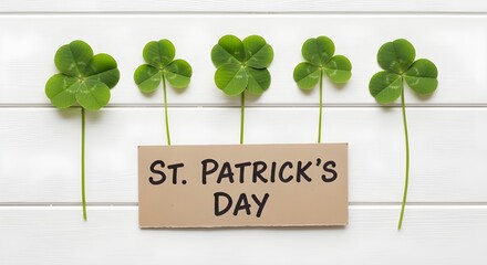 Fototapeta premium St patricks day shamrocks and card with green leaves on white background celebrating irish heritage and luck