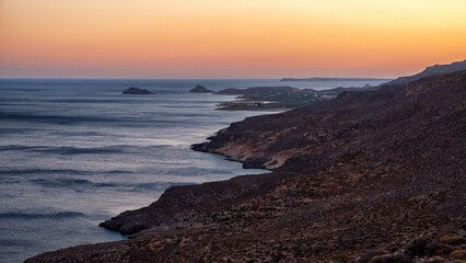 Rocky coastline and Mediterranean sea at sunset near Kato Zakros village on southern coast of Crete Greece