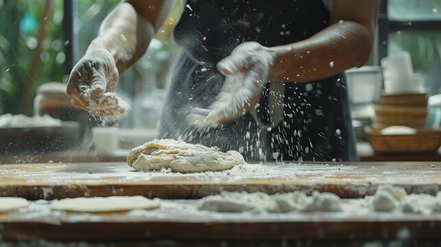Artisan baker skillfully sprinkles flour on dough for homemade bread, pasta, or pizza in bakery