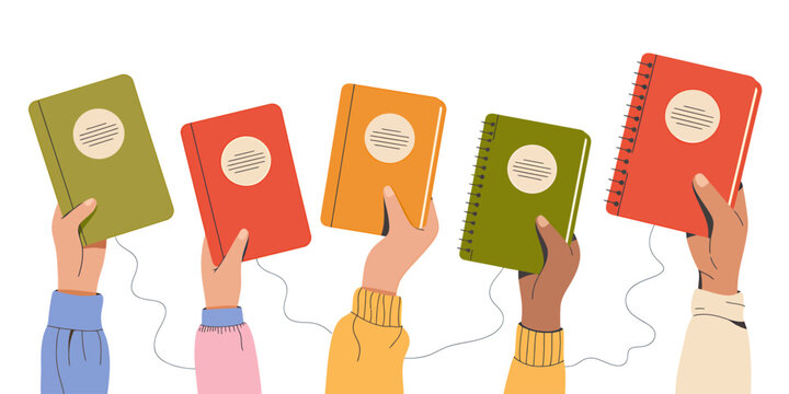Hands holding up colorful notebooks with spiral binding and blank labels