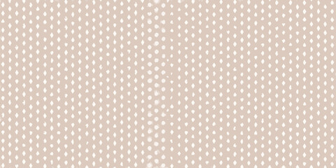 Fototapeta premium A seamless pattern featuring small white leaf shapes on a tan background