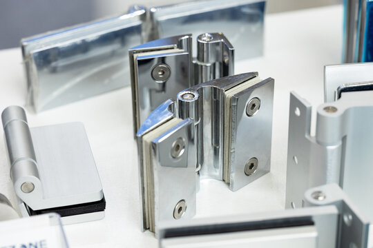 Chrome hinges and handles for glass doors. Hinges and handles for glass windows and doors.