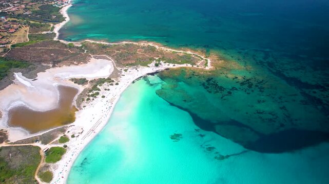 4K Drone Descent over Isuledda Beach. Cinematic Aerial View of Turquoise Caribbean Sea, White Salt Sand and Brown Salt Lake. Unreal Color Contrast. San Teodoro Sardinia Italy. High Quality