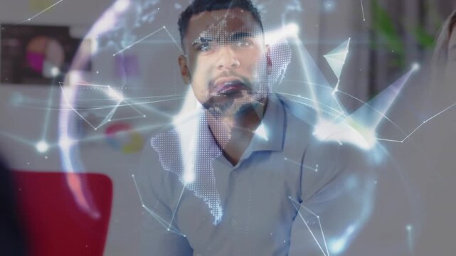 Seated man leaning forward and analyzing tech globe as colleague hand offering it polygons morphing