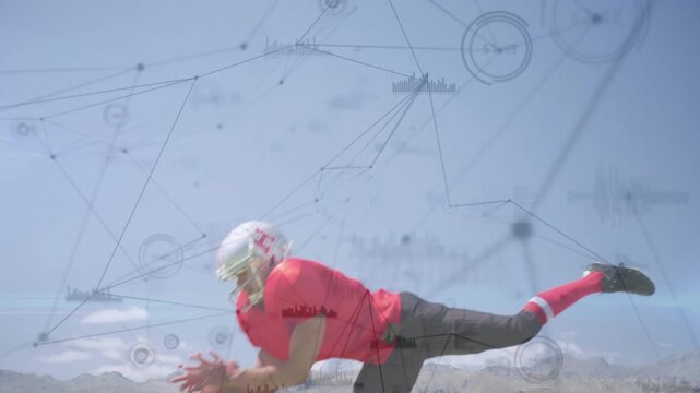 Football player entering catching thrown pass midair diving securing ball with HUD overlay tracking