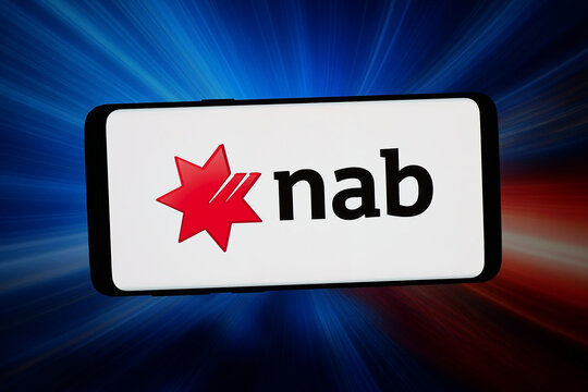 Stuttgart, Germany - 03-04-2026: In this photo illustration, the logo of company National Australia Bank Limited (NAB) is displayed on a smartphone in front of abstract background on computer screen.