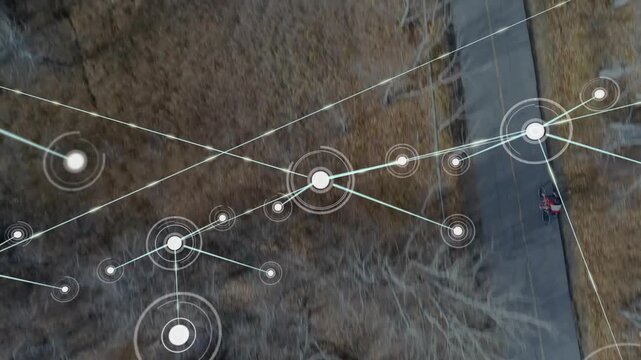 Teen male cycling on paved path, animated nodes appearing over trees and mapping tech network