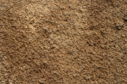 brown stone stucco wall close-up