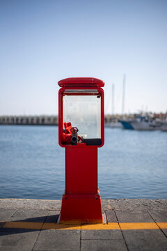 Red fire hydrant cabinet at acciaroli harbour