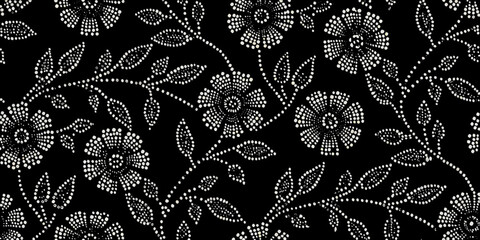Intricate floral pattern with dotted flowers on a black background © ShreeShuvoKumar
