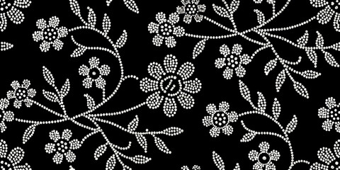 Delicate floral pattern composed of small white dots on a black background © ShreeShuvoKumar