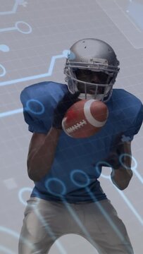 Vertical video: Receiver tracking ball from right, catching and securing ball under blue AI grid