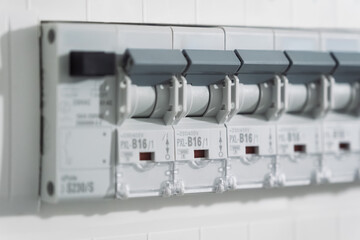Industrial Electrical Panel With Circuit Breakers And Wiring In Modern Utility Cabinet Mounted On Wall