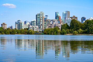 Vancouver skyline as seen from the shore of the Lost Lagoon in Stanley Park, Downtown Vancouver, British Columbia, Canada