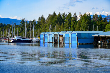Boathouses of the Royal Vancouver Yacht Club in front of Stanley Park in Downtown Vancouver, British Columbia, Canada © Alexandre ROSA