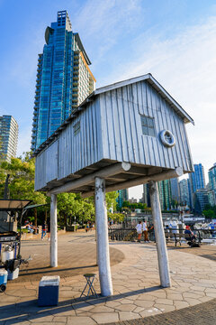 "Lightshed" aluminum sculpture by artist Liz Magor on a bullnose projection of the Coal Harbour seawalk in Downtown Vancouver, British Columbia, Canada