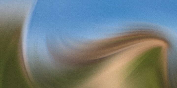 Abstract landscape with green hills and blue sky in soft focus effect