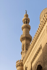Historic spiral minaret of a mosque in Islamic Cairo, Egypt showcasing detailed stone architecture