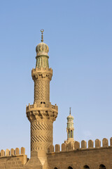 Historic spiral minaret of a mosque in Islamic Cairo, Egypt showcasing detailed stone architecture