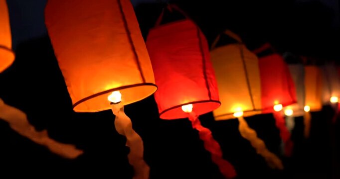 Glowing Lanterns Released into Night Sky.