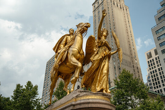 New York City, New York, USA - 08.01.2024: The golden statue of General William Tecumseh Sherman stands proudly in Grand Army Plaza, Manhattan. The equestrian sculpture is accompanied by a winged