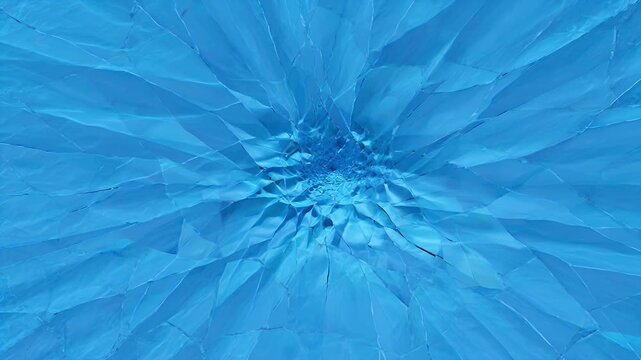 Abstract blue texture with a radial, fractured pattern and icy sheen