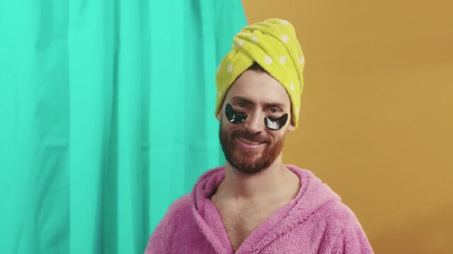 Happy grooming smile, Joyous individual wearing eye patches consistently engaging in personal grooming ritual