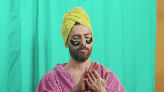 Person massaging lotion with calm demeanor, At home spa guide demonstrating skincare and absorption techniques
