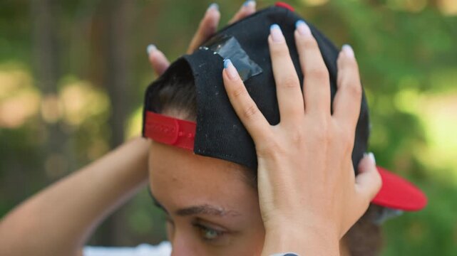 Chic model outdoors, Confident female demonstrating modern fashion amidst green forest environment, Stylish lady exhibiting latest trend clothing confidently within vibrant natural setting