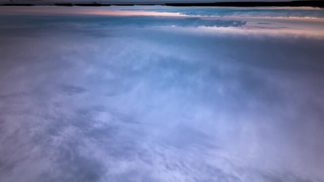 Upside down clouds over sea vertical timelapse surreal inverted sky background