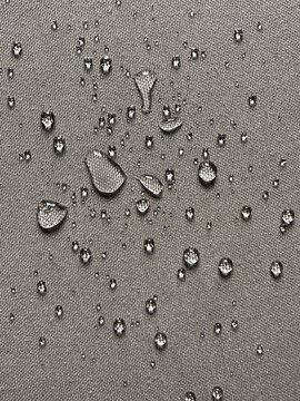 Moisture on Rough Canvas Material, Close-up of Pure Liquid Drops on Weaved Fabric