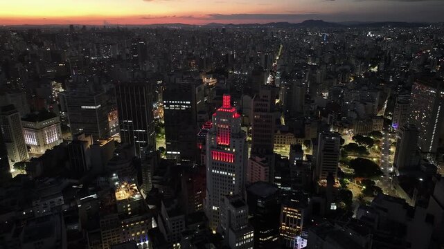 Sunset Santander Lighthouse In Sao Paulo Brazil. High Rise Building And Busy Traffic In Downtown Cityscape. Building Construction Skyline Company Building Awesome.