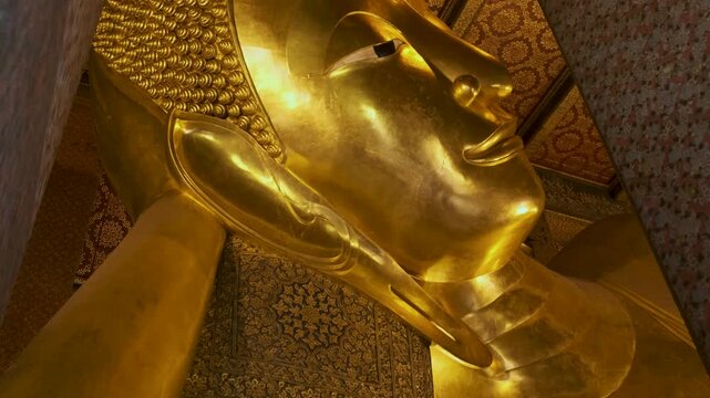 Golden Big Buddha statue in Wat Pho Temple in Bangkok city, Thailand, Asia. Temple of the Reclining Buddha. Popular tourist landmark