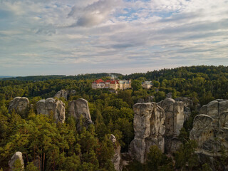 Mystic Castle With Forest Backdrop, Dramatic Cliffs And Lush Trees Surround Historic Czech Fortress Scene