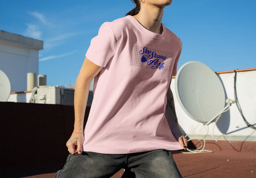 Real photo of woman wearing T-Shirt on Rooftop. PSD template mockup.