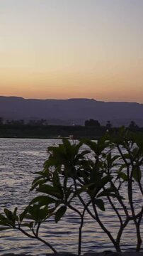 Local Boat Crossing the Nile River at Sunset in Luxor Egypt
