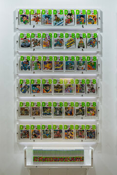 chiba, makuhari - jan 25 2025: Japanese Dragon Ball manga volumes are showcased on white shelves at the Genkidamatsuri event, featuring the iconic 2009 anniversary edition covers by Akira Toriyama.