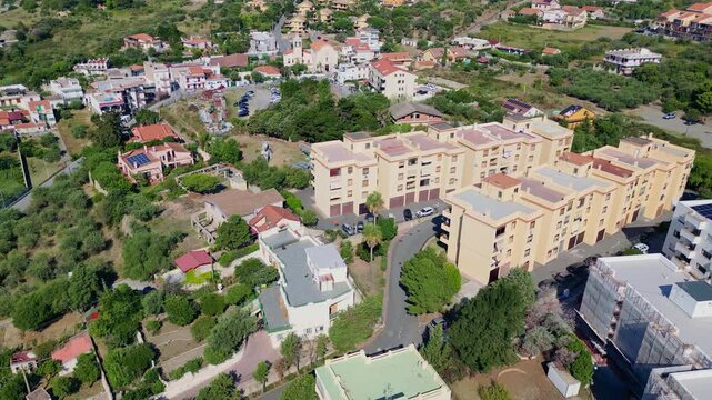 Cinematic aerial drone panorama of Ganzirri and Capo Peloro, Sicily. Stunning coastal landscape near Messina with the Lakes of Ganzirri and the narrow sea channel between Tyrrhenian and Ionian waters
