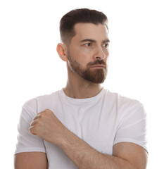 Obraz premium Handsome bearded man posing against white background
