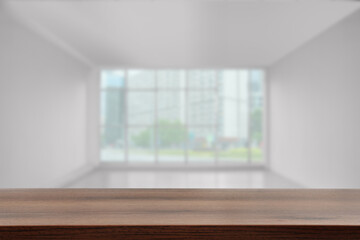 Fototapeta premium Empty wooden table in room, selective focus. Space for design